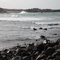 Portinfer Bay and surfers, Guernsey, 2010