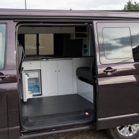 VW T5 storage cupboards, fridge and hob.