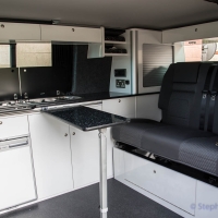 VW T5 storage cupboards, fridge and hob, table