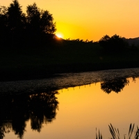 Sunset over Fforest Field lake