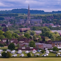 View of Salisbury Cathedral and campsite from Old Sarum. Van the Van behind tree on left.