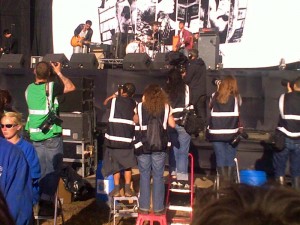 Array of photographers in front of the stage